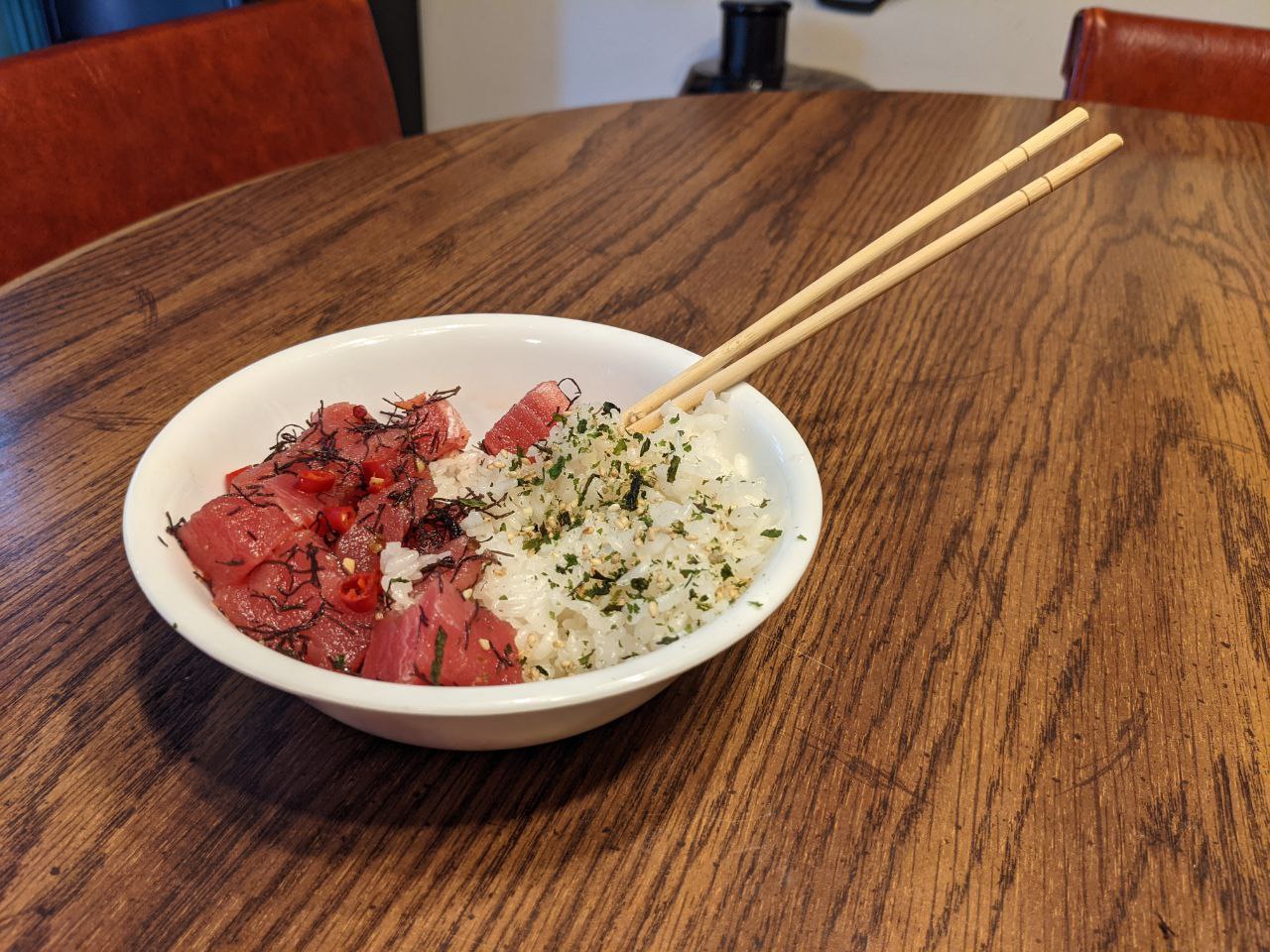 Bowl of Ahi Ogo Poke with a cayenne from the garden, and rice with furikake.