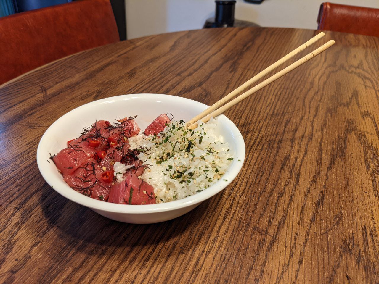 Bowl of Ahi Ogo Poke with a cayenne from the garden, and rice with furikake. Bowl of Ahi Ogo Poke with a cayenne from the garden, and rice with furikake.