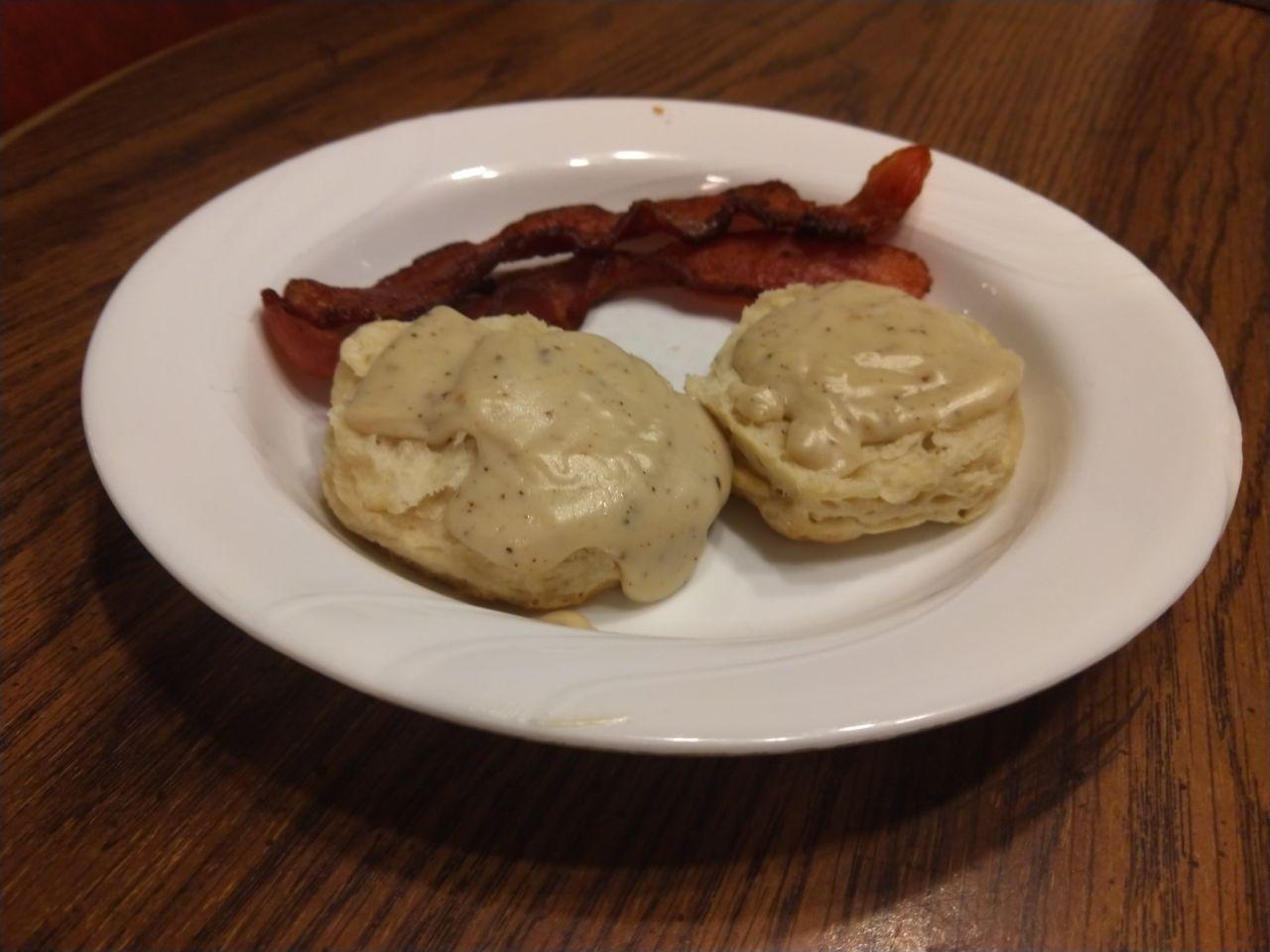 Biscuits and gravy with bacon. Biscuits and gravy with bacon.