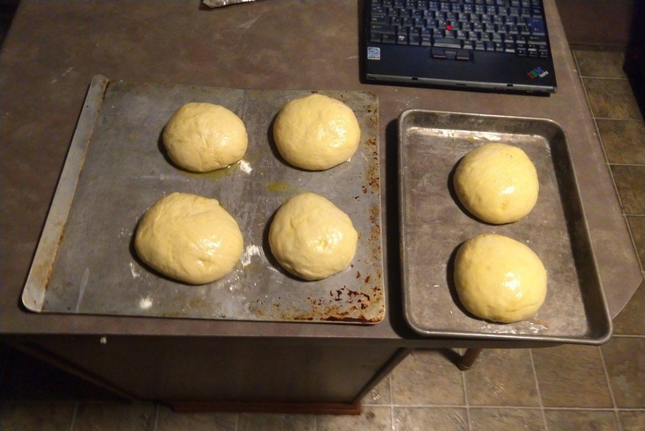 Buns after brushing with egg wash. Buns after brushing with egg wash.