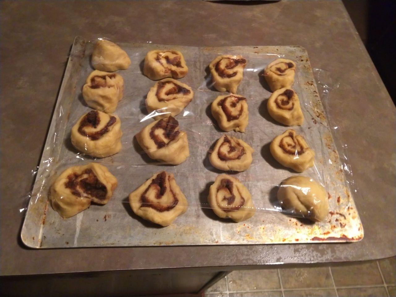 Cinnamon rolls in a pan, ready to rise in the fridge over night.