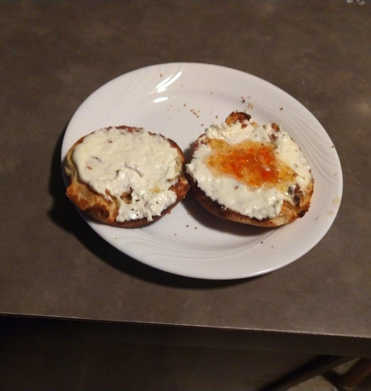 Toasted english muffin with habanero jam and cream cheese. Toasted english muffin with habanero jam and cream cheese.