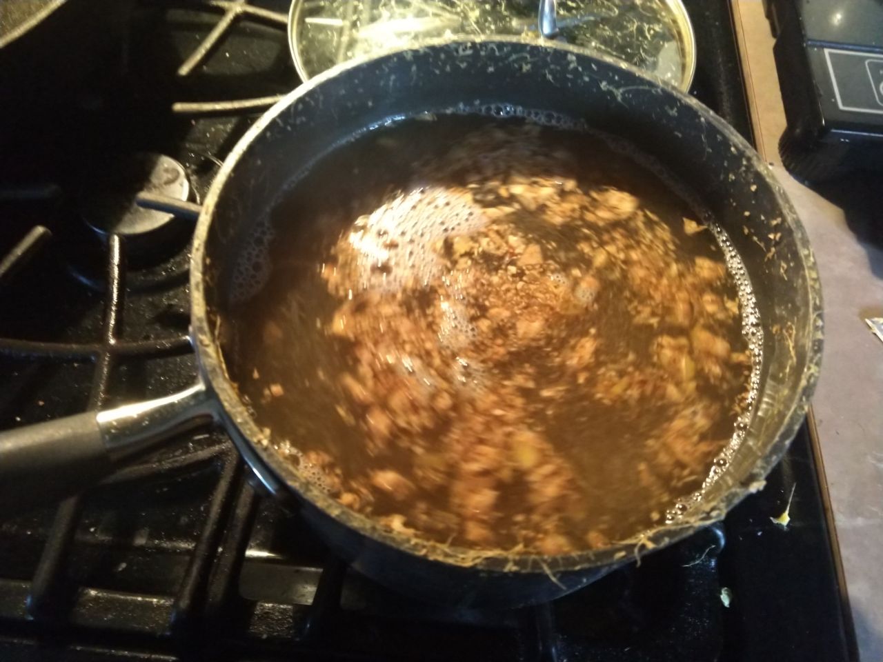 Boiling ginger with water and sugar. Boiling ginger with water and sugar.