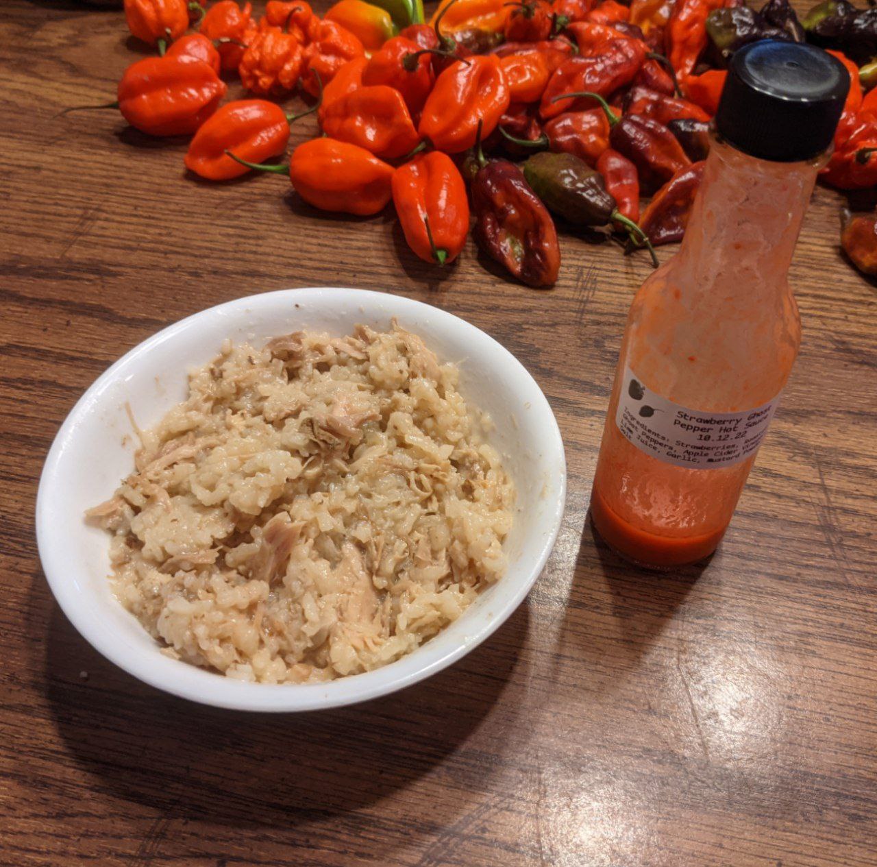 Bowl of turkey jook with hot sauce. Bowl of turkey jook with hot sauce.