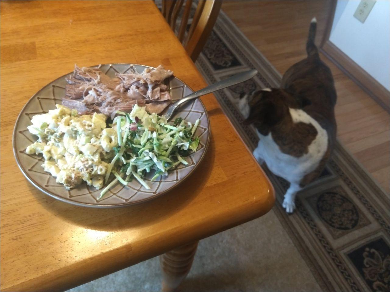 Kalua pork on a page with mac salad. Kalua pork on a page with mac salad.