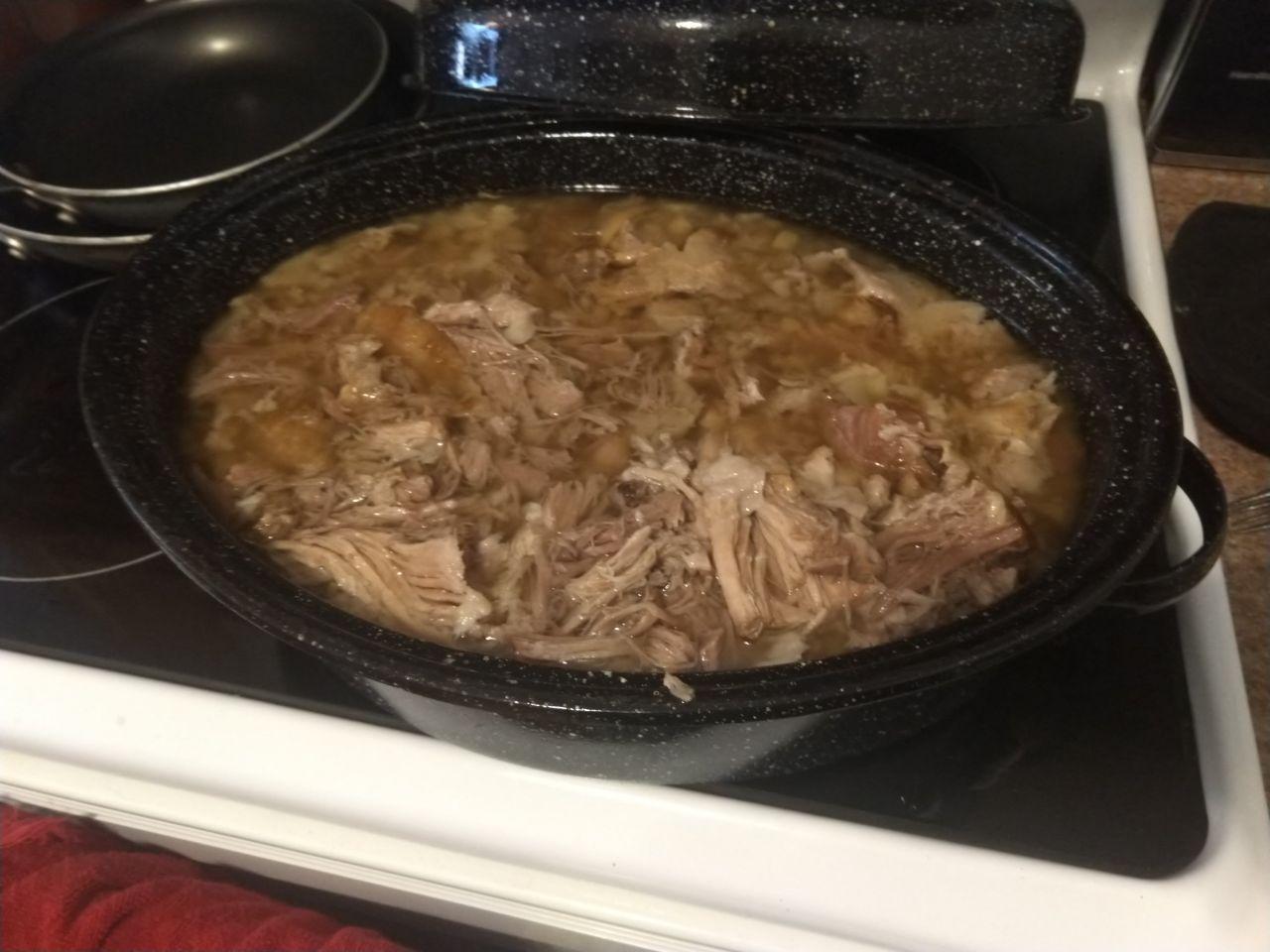 Kalua pork after shredding on the stove. Kalua pork after shredding on the stove.