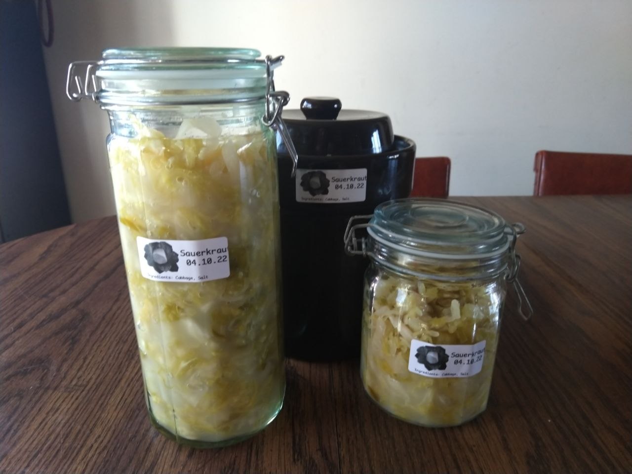 Sauerkraut moved out of crock into glass jars. Sauerkraut moved out of crock into glass jars.