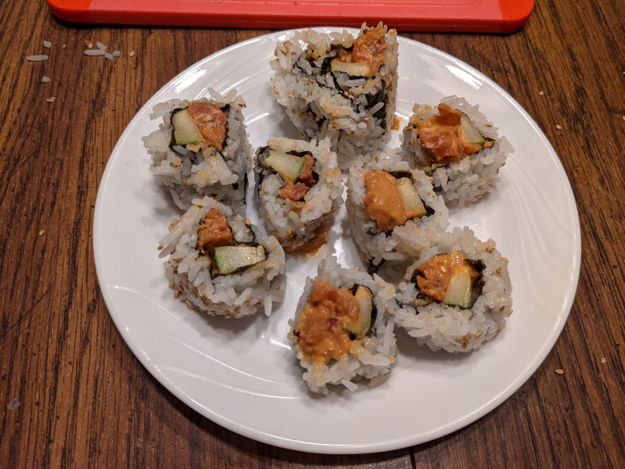 Spicy tuna rolls on a plate.
