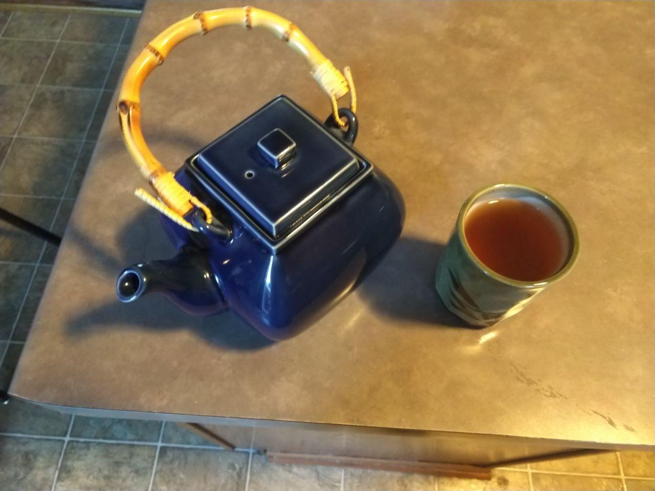 A blue teapot with a bamboo handle that I found at a thrift store.