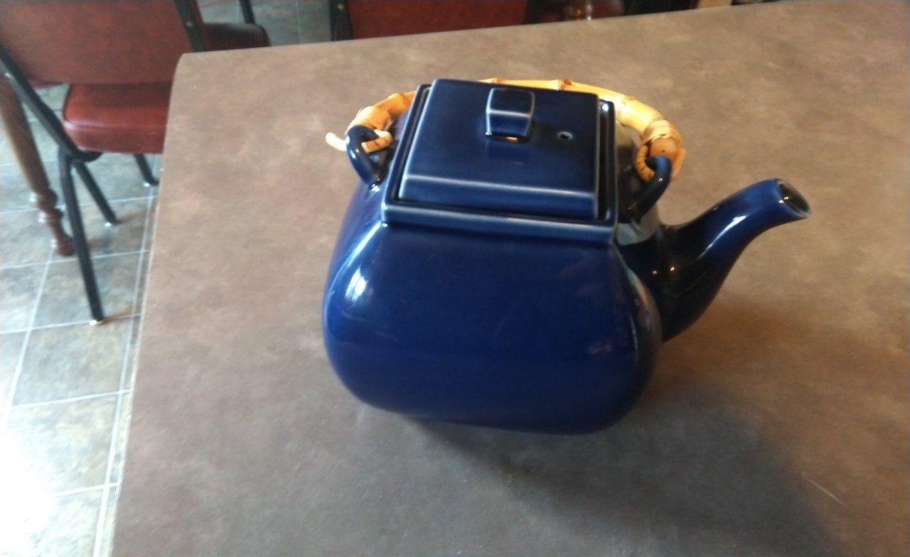 A blue teapot with a bamboo handle that I found at a thrift store.